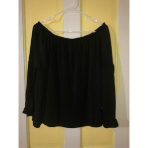 Black off the shoulder shirt.